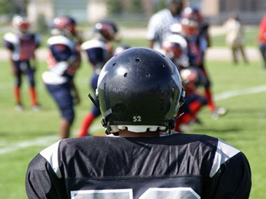 Mitigating TBI Risks in Youth Football and Hockey